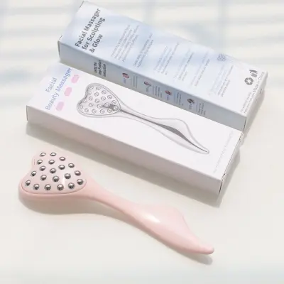 Srčasti masažer za lice i oči s valjkom 304 nehrđajućeg čelika Pink